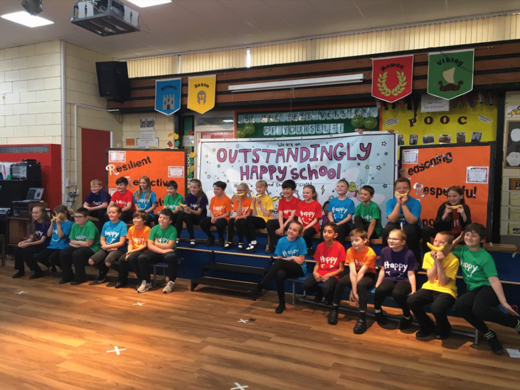 group of children standing in front of banners